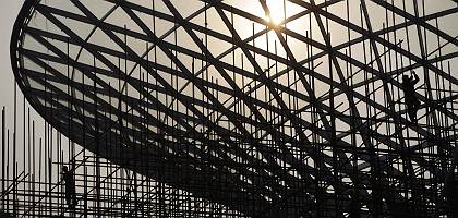 Workers in China putting together a solar energy facility in Shanghai in preparation for the 2010 Expo.